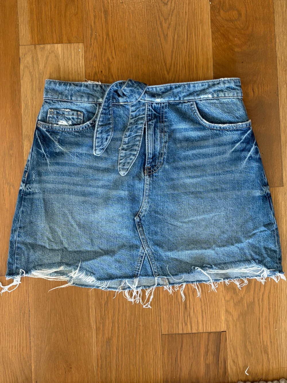 PAIGE Blue Denim Mini Skirt with Tie Waist and Raw Hem